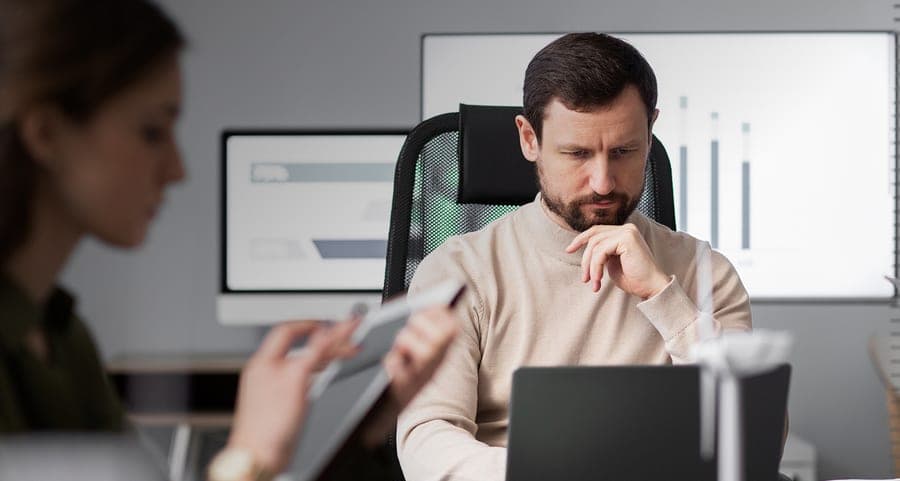 Founder thinking through a statement of need at his desk